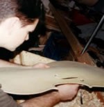 Chris Carving F-Hole in Cello Belly